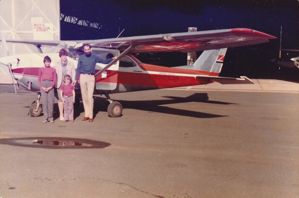 Far West Mission. Rev Chris Sparks and family, with the plane in the Bourke hangar