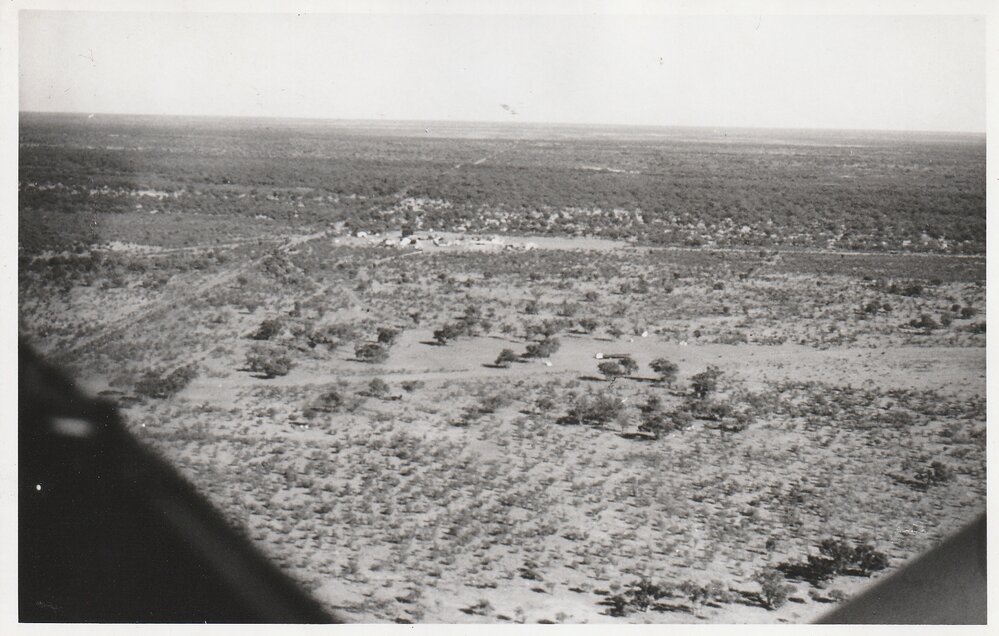 Far West Mission. Aerial view of Hungerford, cut in half by the Border Fence 